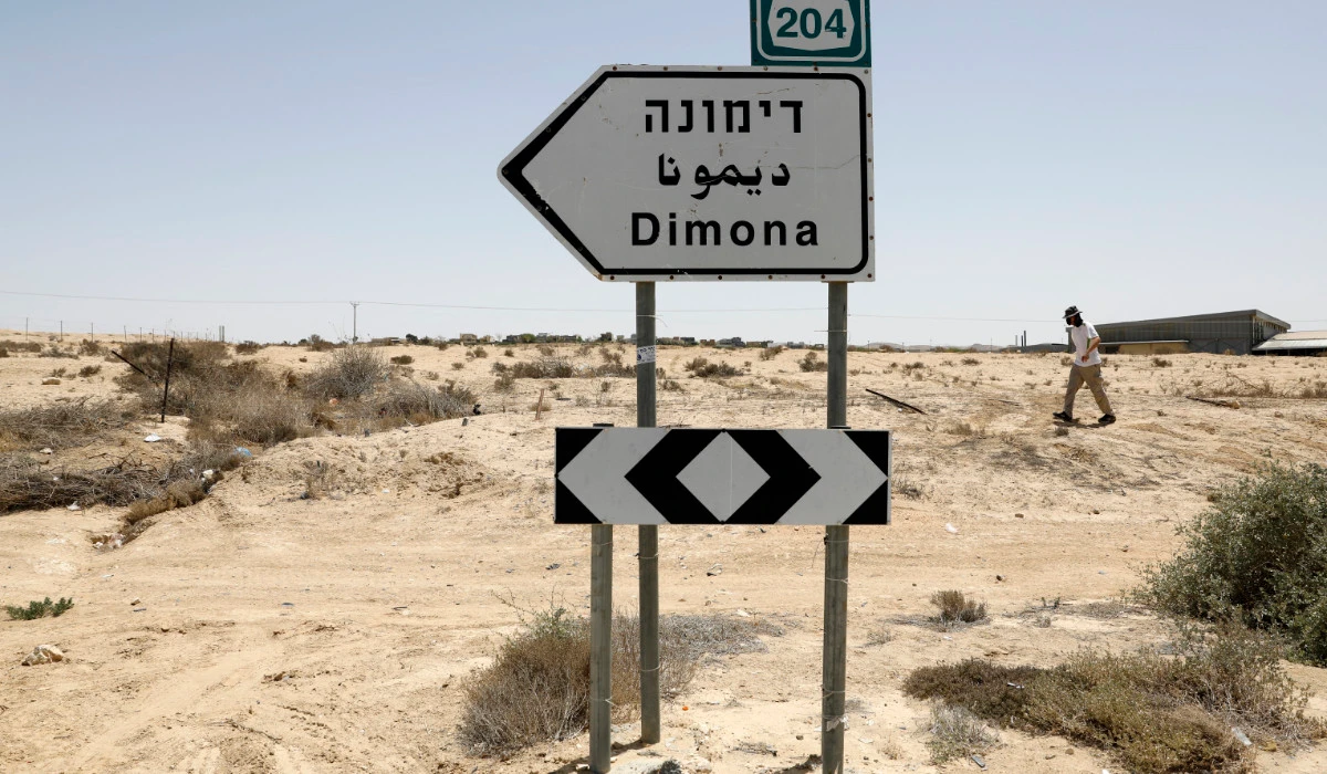 This picture taken on April 22, 2021 shows a view of a road sign directing towards the city of Dimona, close to the nuclear power plant in the southern Israeli Negev desert. (AFP)