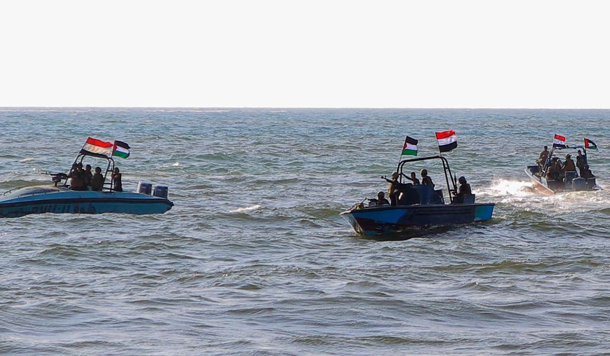 Members of the Yemeni Coast Guard affiliated with the Houthi group patrol the sea as demonstrators march through the Red Sea port city of Hodeida in solidarity with the people of Gaza on January 4, 2024, amid the ongoing battles between Israel and the militant Hamas group in Gaza. (AFP)