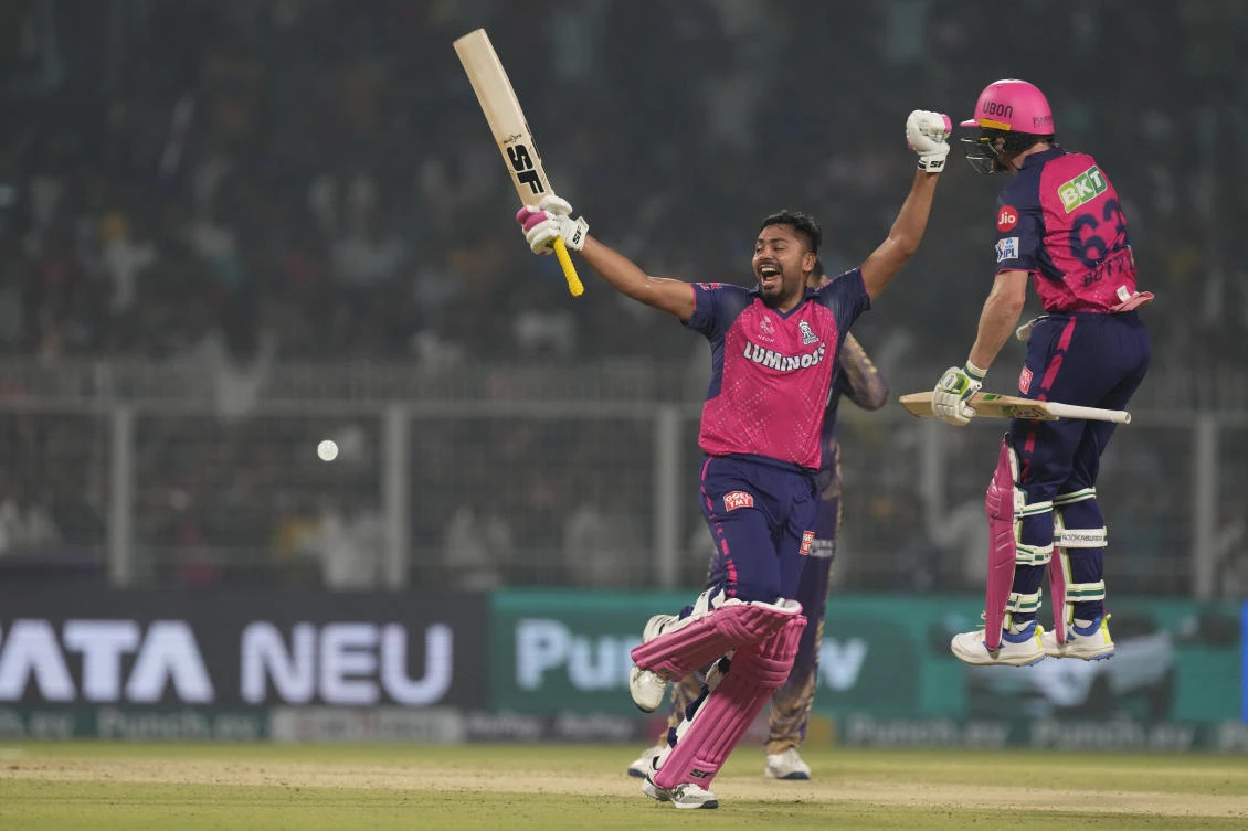 Rajasthan Royals’ Jos Buttler, right, and Avesh Khan celebrate their IPL win over Kolkata Knight Riders, Kolkata, India, Tuesday, April 16, 2024. (AP Photo)