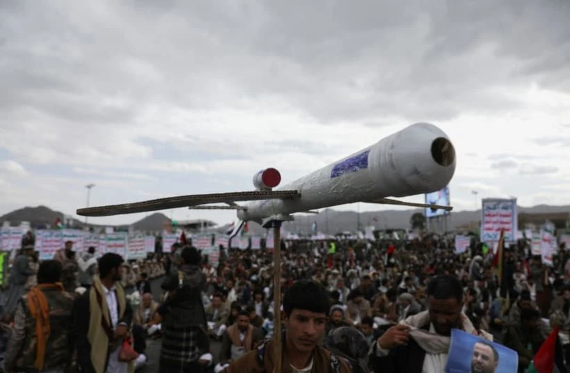 A Houthi supporter carries a mock drone, Sanaa, Yemen, Feb. 16, 2024. (Reuters)
