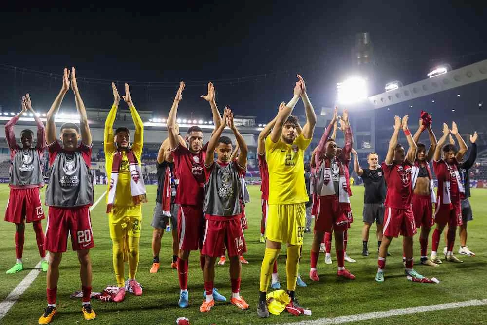 Qatar players celebrate their team’s victory against Jordan at the 2024 AFC U23 Asian Cup Group A match in Doha on April 18, 2024. (AFP)
