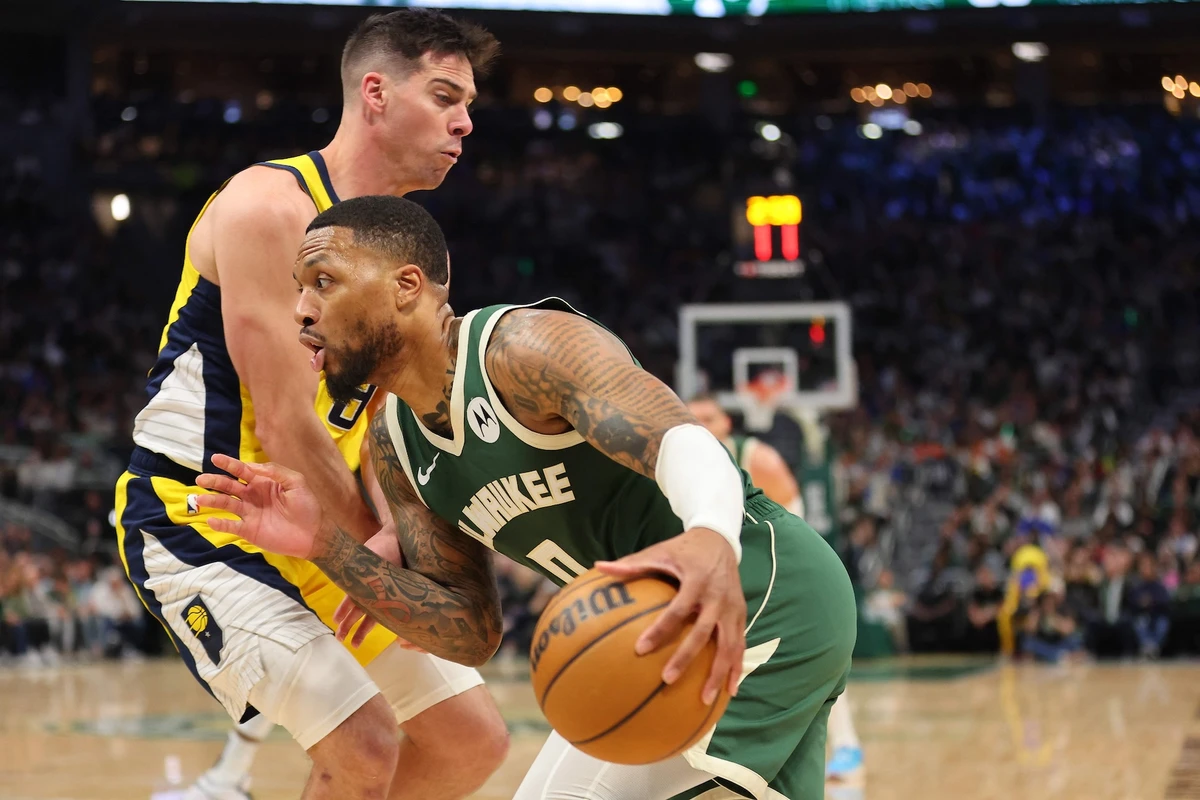 Damian Lillard of the Milwaukee Bucks drives around Doug McDermott of the Indiana Pacers during the second half of Game 1 of the Eastern Conference First Round Playoffs at Fiserv Forum on April 21, 2024 in Milwaukee, Wisconsin.(AFP)