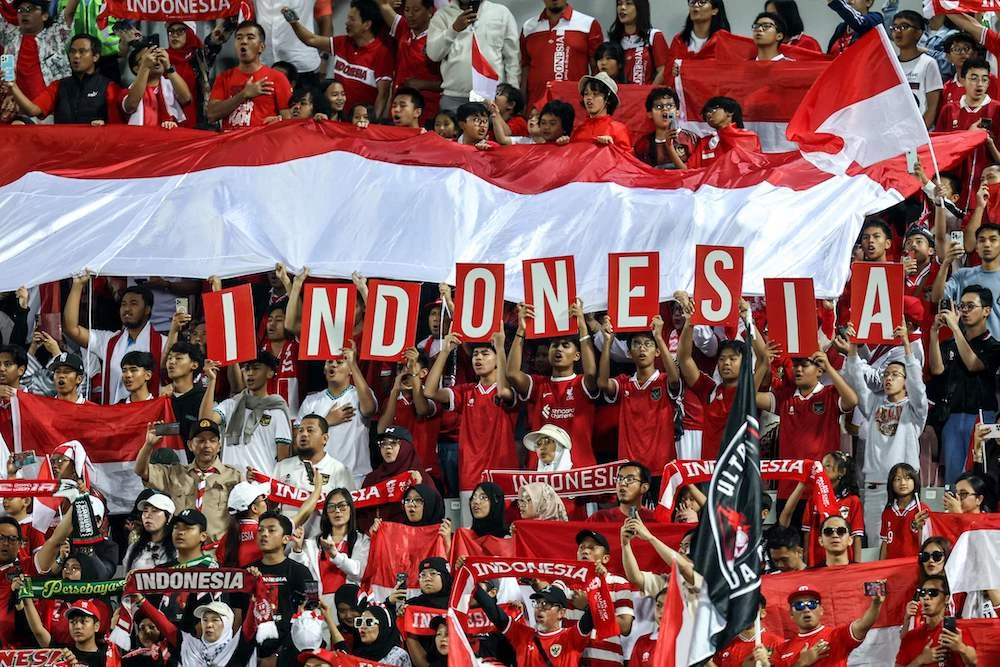 Indonesia’s supporters cheer for their team during the AFC U23 Asian Cup Group A match between Jordan and Indonesia at Abdullah Bin Khalifa Stadium in Doha on April 21, 2024. (AFP)
