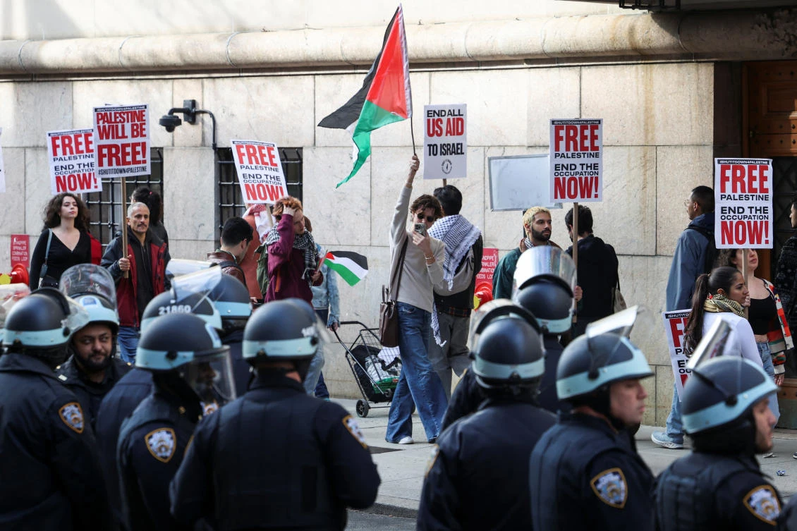 Police watch as demonstrators protest near a closed entrance of Columbia University where students continue to protest in support of Palestinians, during the ongoing conflict between Israel and the Palestinian Islamist group Hamas (REUTERS)