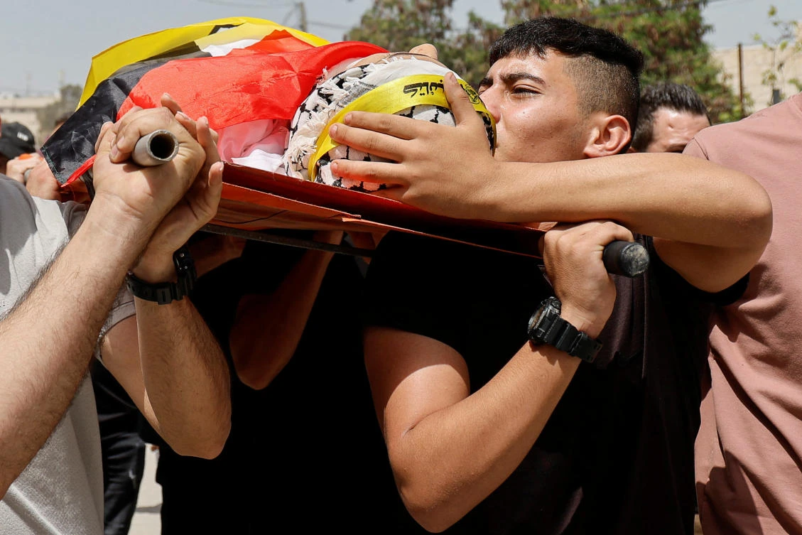 Mourners carry the body of Palestinian Khaled Orouq, 16, who was killed in an Israeli raid, during his funeral in Jenin, in the Israeli-occupied West Bank on Apr. 25, 2024. (Reuters)
