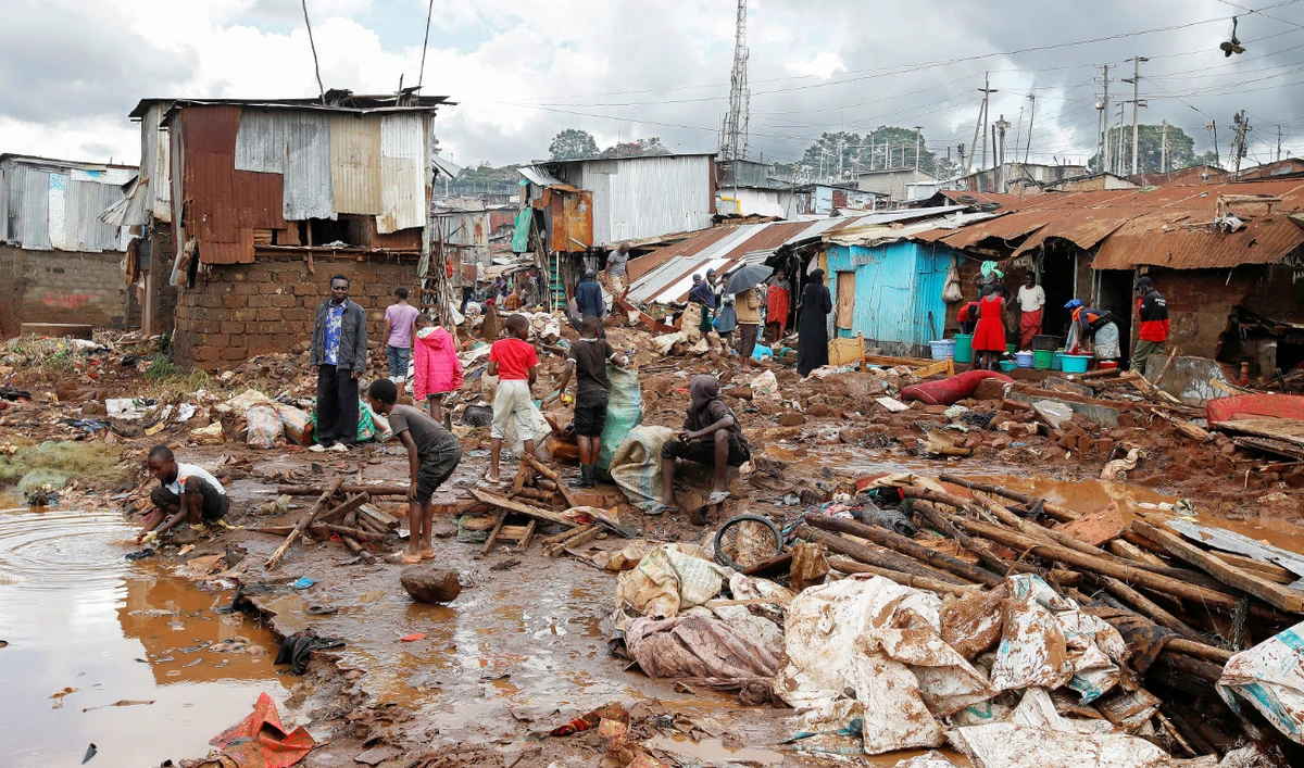 Residents sift through the rubble on Thursday as they recover their belongings after the Nairobi River burst its banks and destroyed their homes within the Mathare Valley settlement in Kenya. (Reuters)