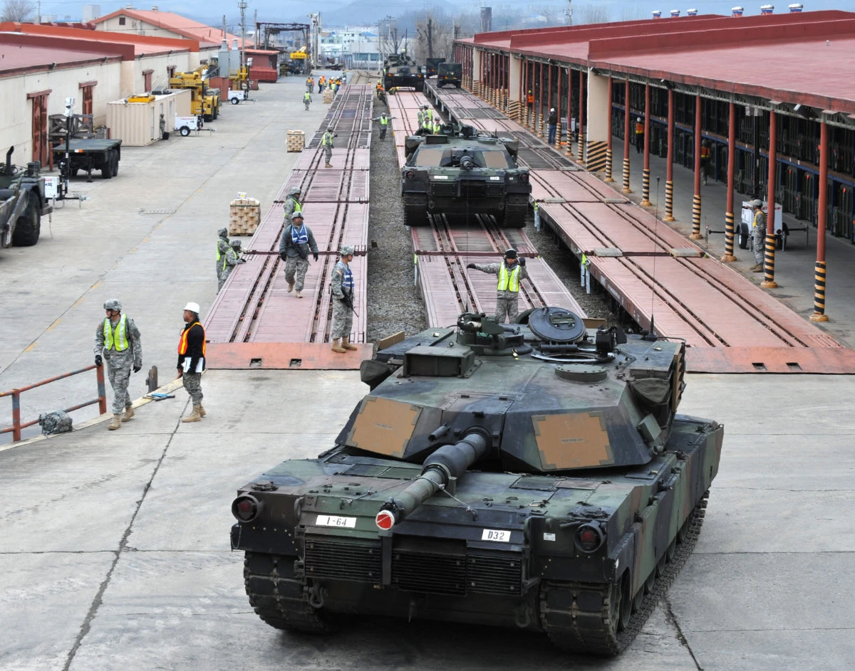 US M1A1 Abrams tanks are driven onto a train during an operation drill in Chilgok, South Korea. Of the 31 M1A1 tanks sent by the US to Ukraine in January 2023, five had been destroyed by Russian drones. (AFP/File photo)