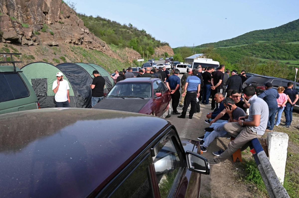 Armenian demonstrators block a road outside the town of Tavush, 10 kilometers from the border with Azerbaijan, on April 25, 2024. Dozens of Armenian protesters blocked several roads across the country, including in the capital Yerevan, angry at what they see as territorial concessions to arch-foe Azerbaijan. (AFP)
