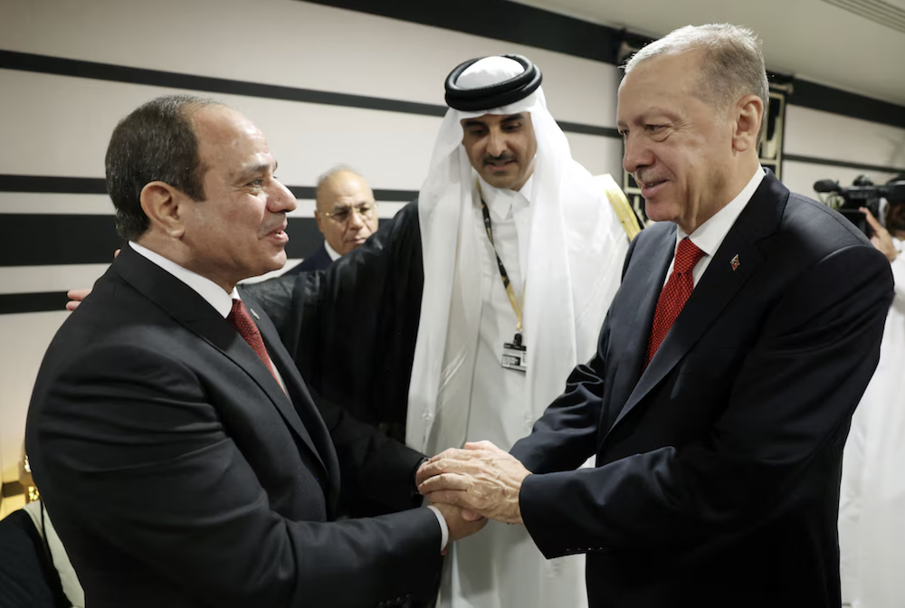 Turkey's President Erdogan shakes hands with Egyptian counterpart El-Sisi in 2022. (Reuters)
