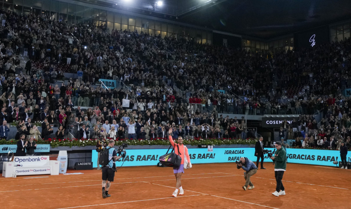 Rafael Nadal, of Spain, center, waves to the crowd after losing a match against Jiri Lehecka, of Czech Republic, during the Mutua Madrid Open tennis tournament in Madrid, Tuesday. (AP)