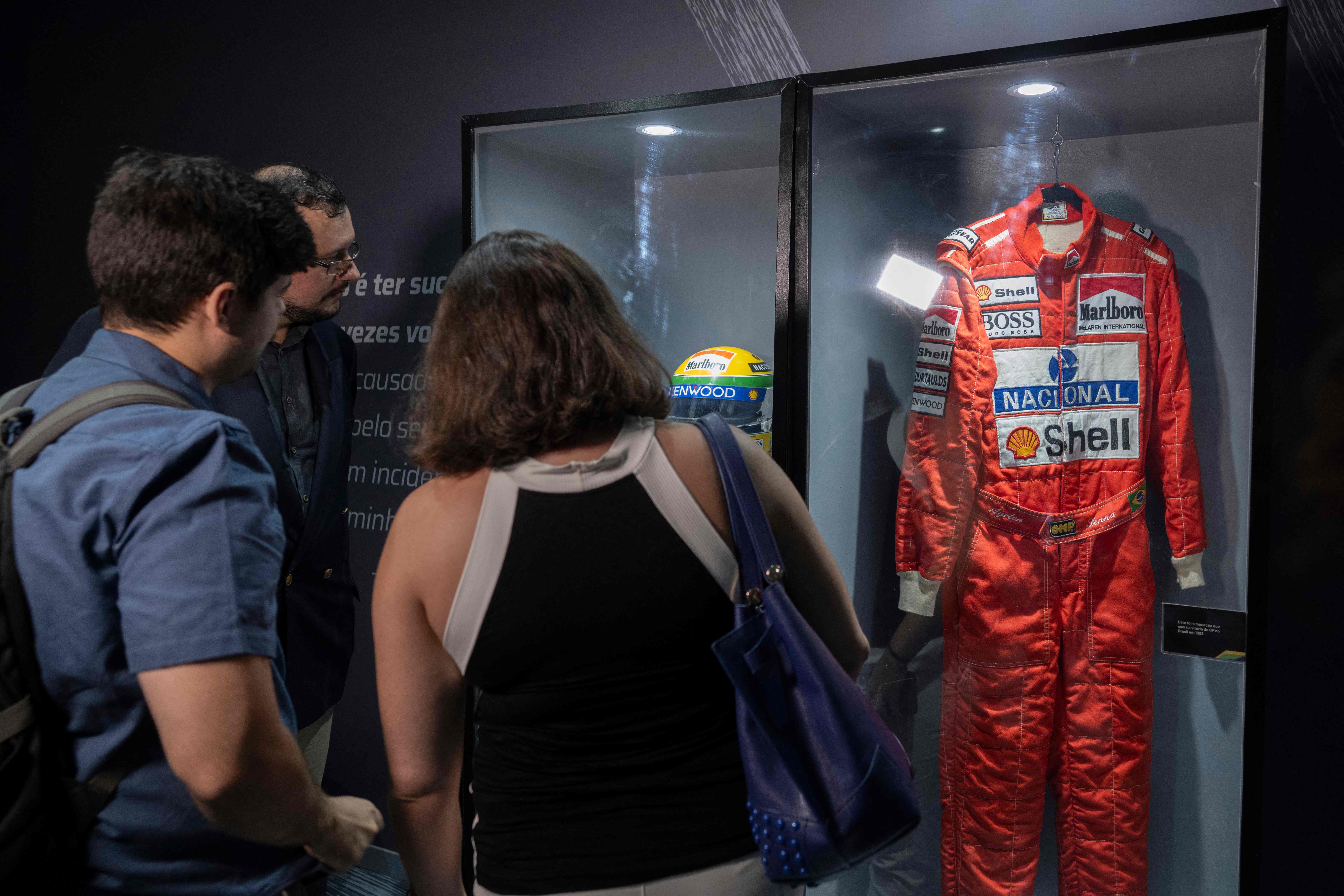 People visit the exhibition "I, Ayrton Senna da Silva" displayed in Rio de Janeiro, Brazil, on April 30, 2024. Thirty years after his death at the San Marino Grand Prix, Ayrton Senna is still adored in Formula One, a sport his fatal accident reshaped. (AFP)