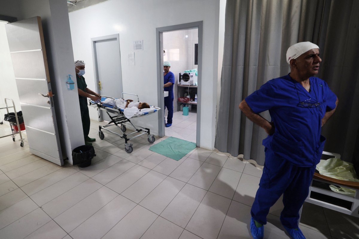Medics care for patients at a clinic set up by Doctors Without Borders (MSF) treating severe injuries and burns sustained in Israeli bombardment, at the Rafah Indonesian Field Hospital in Rafah in the southern Gaza Strip on April 24, 2024, amid ongoing battles between Israel and the Palestinian Hamas movement.(AFP)