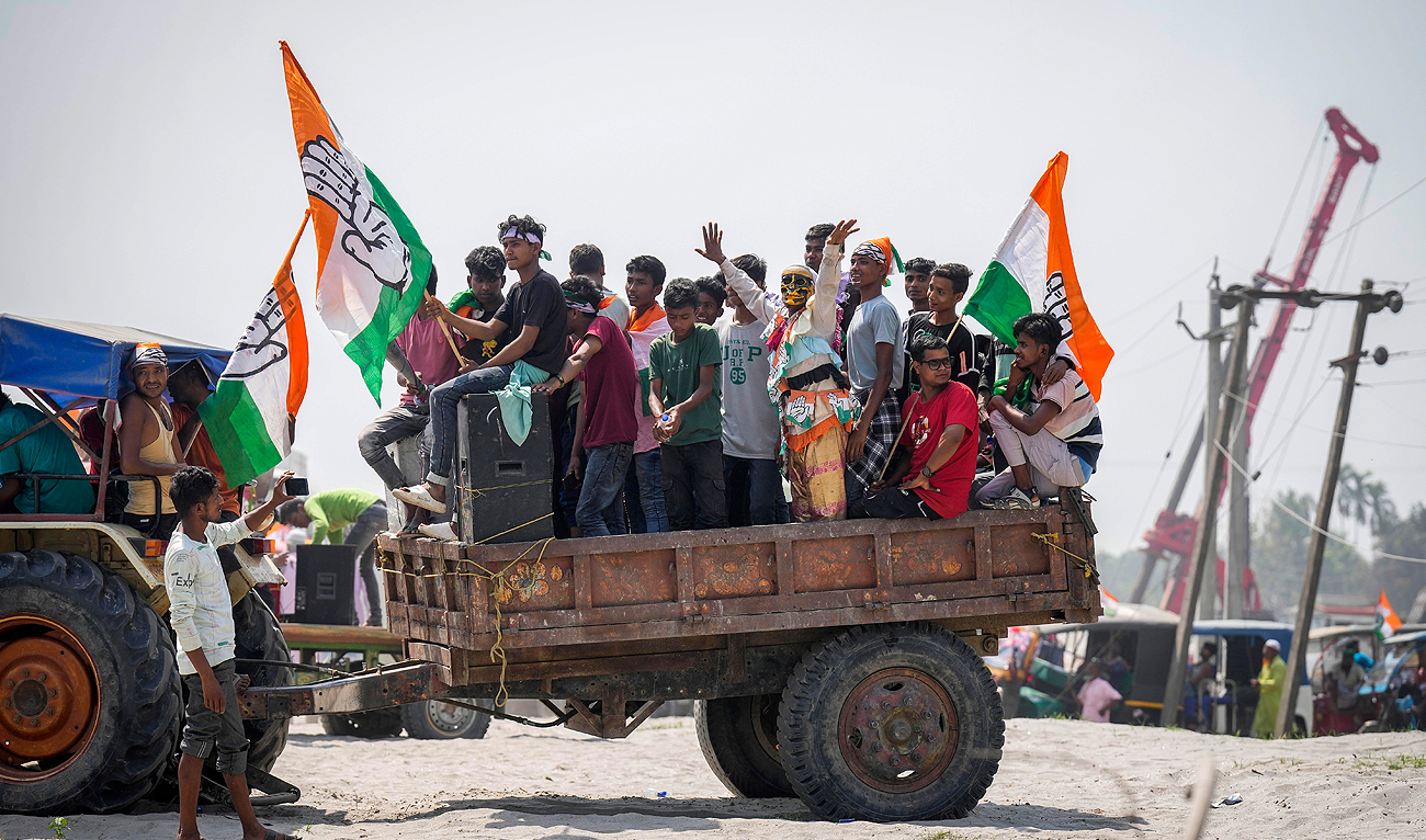 Congress party supporters arrive to attend an election rally by party leader Priyanka Gandhi in Dhubri district in lower Assam, India on May 1, 2024. (AP)