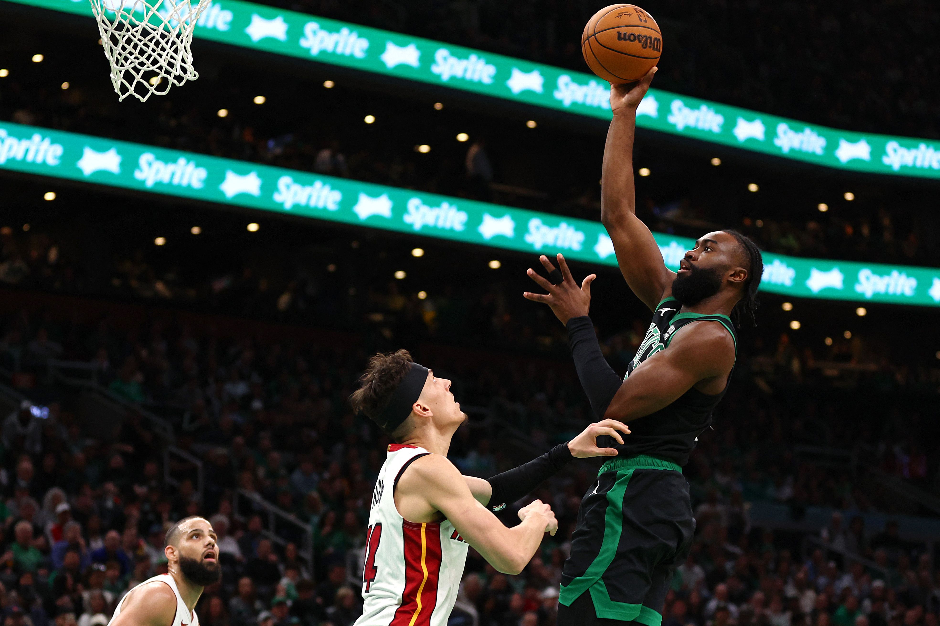 Jaylen Brown of the Boston Celtics takes a shot over Tyler Herro of the Miami Heat during the third quarter of Game 5 of the Eastern Conference First Round Playoffs at TD Garden on May 01, 2024 in Boston, Massachusetts. (GETTY IMAGES NORTH AMERICA / AFP)