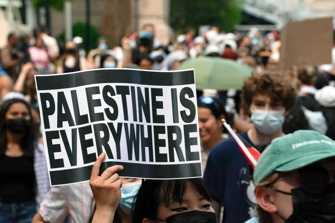 A protester holds a sign during a march on Columbia University campus in support of a protest encampment supporting Palestinians, despite a 2 p.m. deadline issued by university officials to disband or face suspension, in New York City on Apr. 29, 2024. (Reuters)
