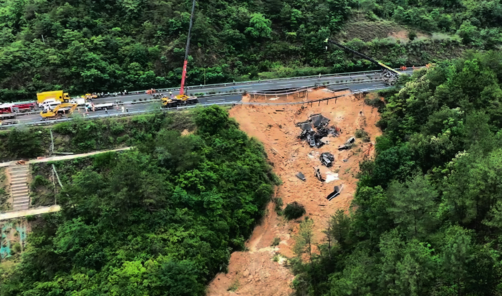 In this photo released by Xinhua News Agency, an aerial photo shows rescuers working at the site of a collapsed road section of the Meizhou-Dabu Expressway in Meizhou, south China's Guangdong Province, on May 1, 2024. (AP)