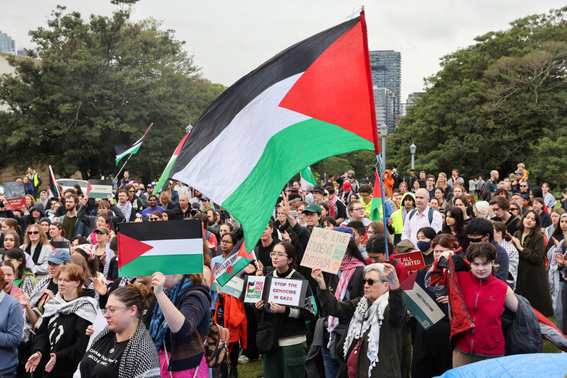Members of the Palestine Action Group gather ahead of a rally, amid the ongoing conflict between Israel and the Palestinian Islamist group Hamas, in Sydney, Australia. (Reuters)