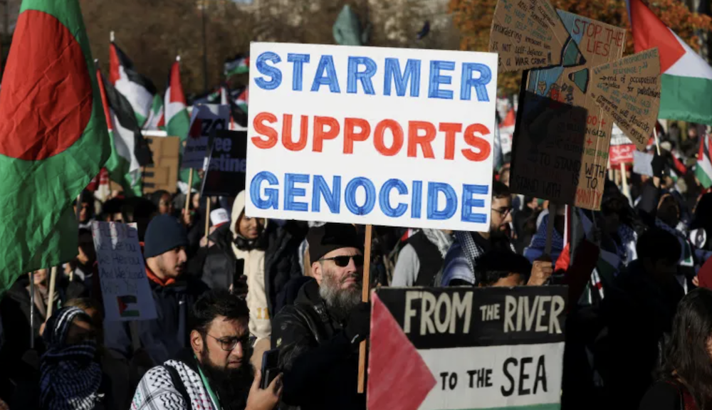 A demonstrator holds a placard referencing Labour Party leader Keir Starmer as people protest in solidarity with Palestinians in Gaza. (Reuters/File Photo)