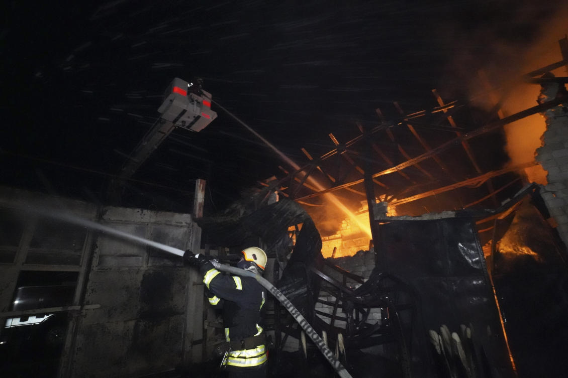 Above, firefighters try to put out the fire after a hit by Russian shelling in Kharkiv, Ukraine on May 4, 2024. (AP)