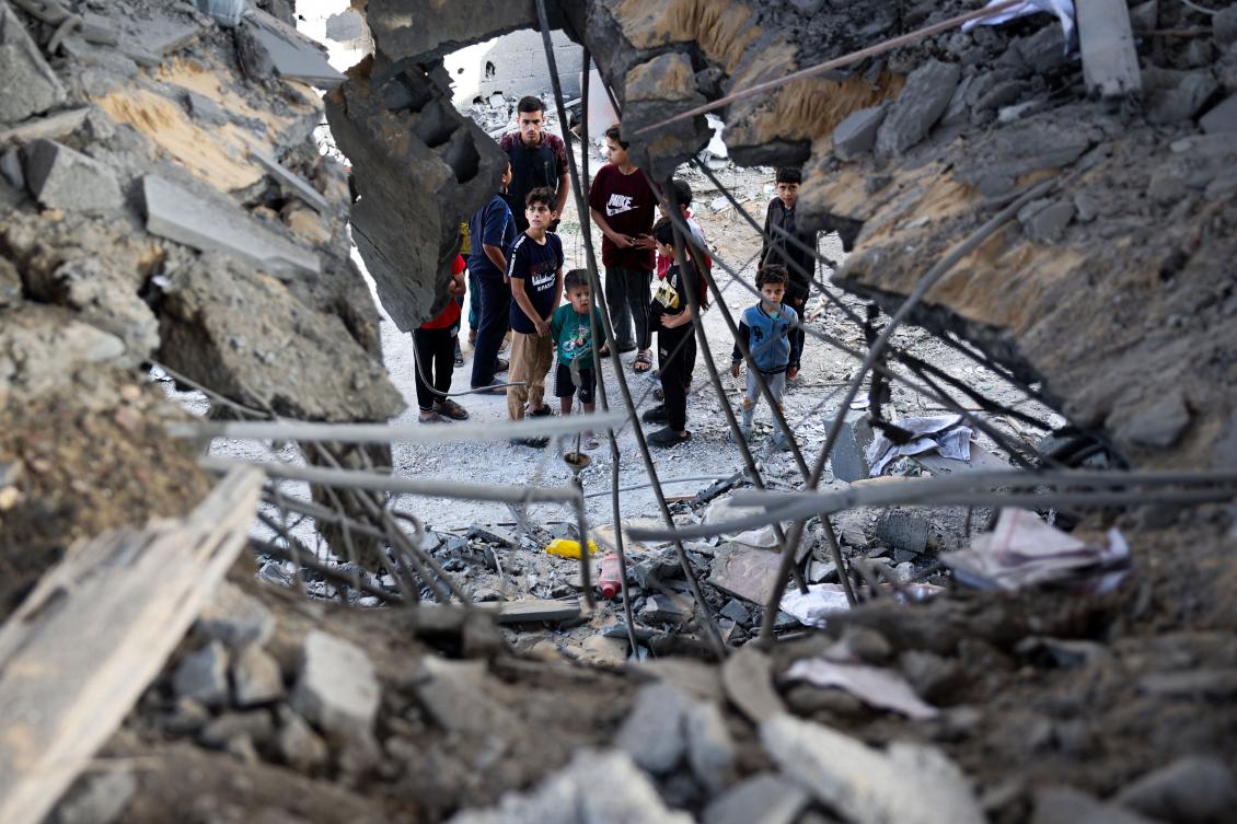 Palestinians check the damage in the aftermath of Israeli bombing in Rafah in the southern Gaza Strip on May 3, 2024. (AFP)