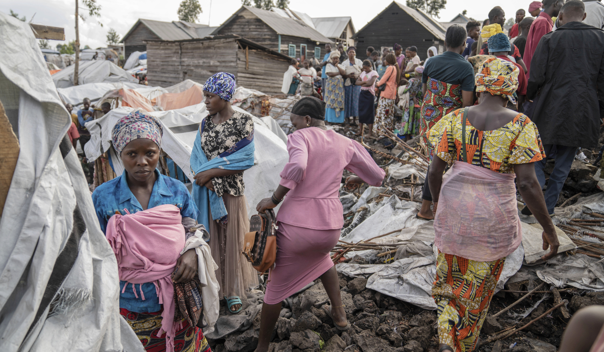 People gather at the side of an explosion in a refugee camp on the outskirts of Goma, Democratic Republic of the Congo, Friday, May, 3, 2024. (AP)