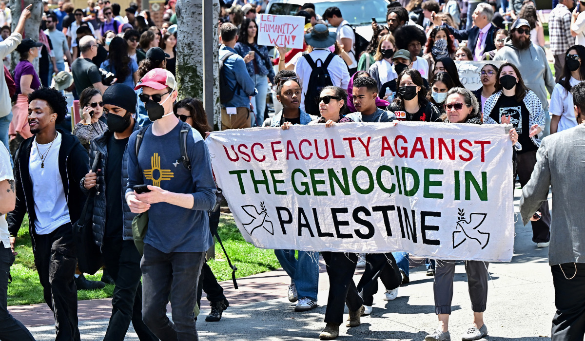 Faculty join pro-Palestinian students as they protest the Israel-Hamas war on the campus of the University of Southern California in Los Angeles, on April 24, 2024. (AFP)