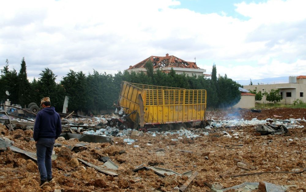 A man inspects the scene of an overnight Israeli air strike that targeted an area near the Bekaa Valley city of Baalbek, around 80 kilometers from the Israel-Lebanon frontier, on May 6, 2024. (AFP)