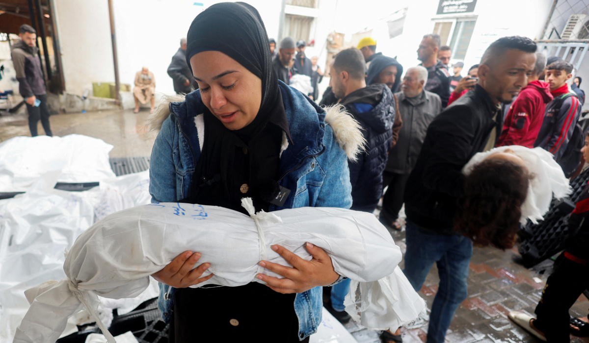 A mourner reacts holding the body of a Palestinian child killed in an Israeli strike, amid the ongoing conflict between Israel and the Palestinian Islamist group Hamas, at Abu Yousef al-Najjar hospital in Rafah, in the southern Gaza Strip, May 6, 2024. (REUTERS)