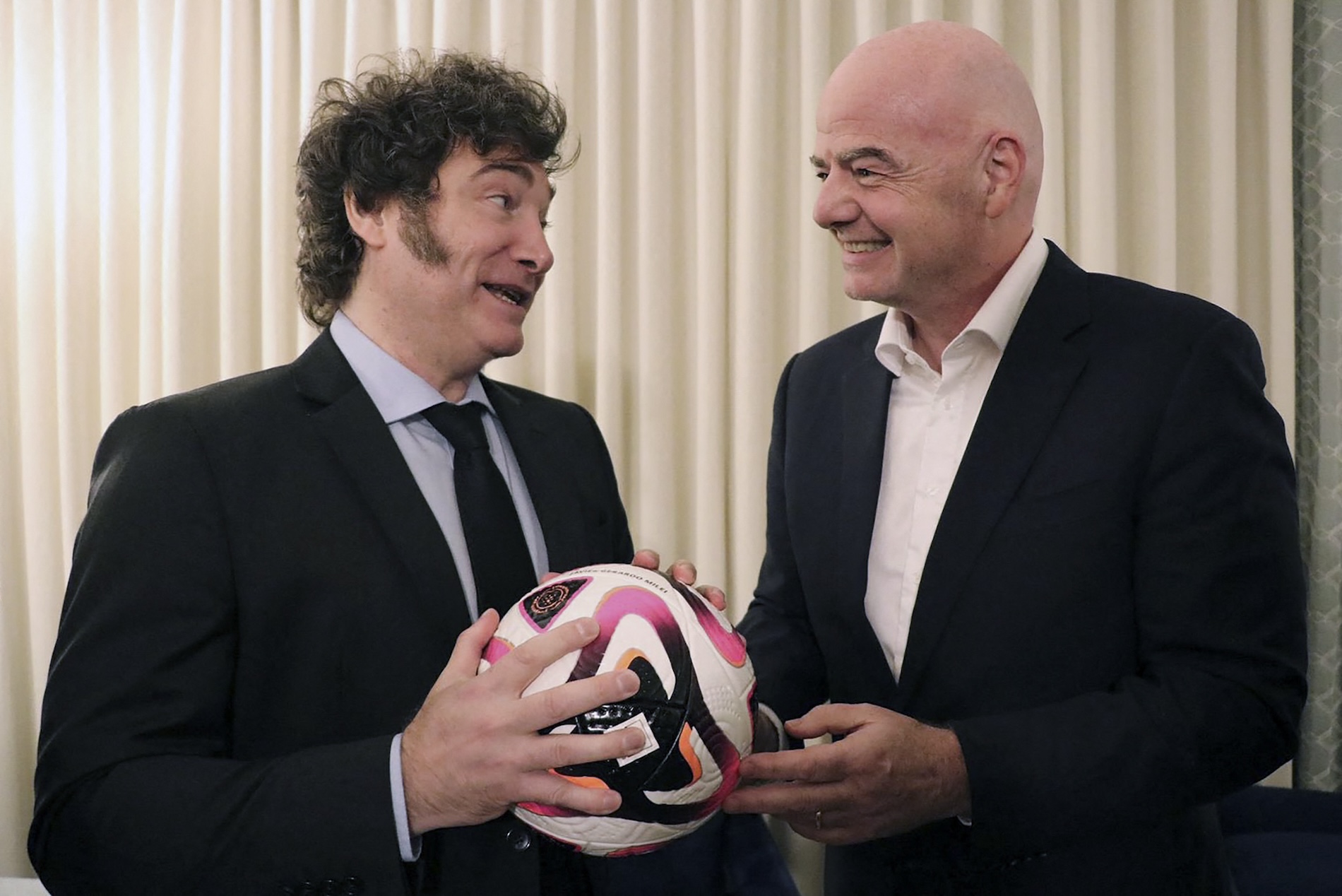 This handout picture released by the Argentinian Presidency shows Argentina's President Javier Milei (L) with FIFA's President Gianni Infantino at the Milken Institute's Global Conference in Beverly Hills, California, on May 6, 2024. (AFP)