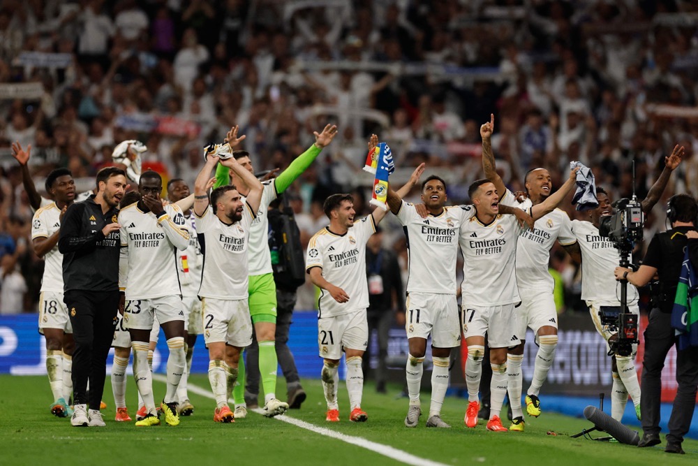 Madrid players celebrate after beating Bayern Munich 2-1. (AFP)