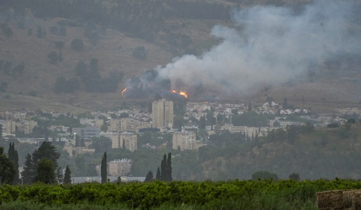 Smoke rises over the city of Kiryat Shmona following a rocket that was launched from Lebanon and fired towards Israel, amid ongoing cross-border hostilities between Hezbollah and Israeli forces, in Kiryat Shmona, northern Israel, May 10, 2024. (REUTERS)