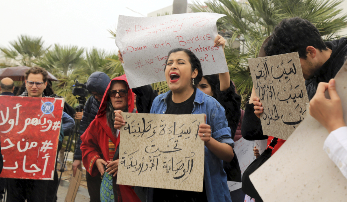 Activists demonstrate outside the delegation of the European Union to Tunisia against migrant deals with EU, in the capital Tunis, Thursday, May 9, 2024. (AP)