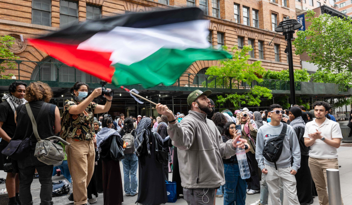 Pro-Palestinian students and others gather outside of Baruch College in Manhattan to protest the school's stance on Israel on May 09, 2024 in New York City. (AFP)