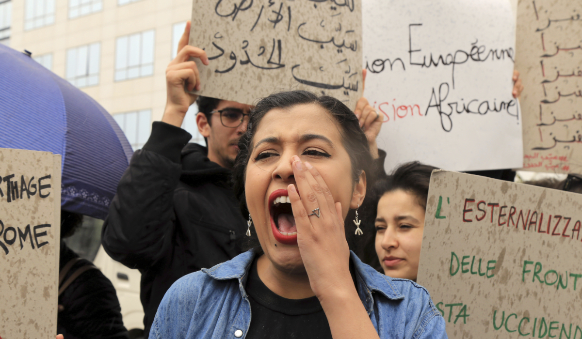 Activists demonstrate outside the delegation of the European Union to Tunisia against migrant deals with EU, in the capital Tunis, Thursday, May 9, 2024. (AFP)