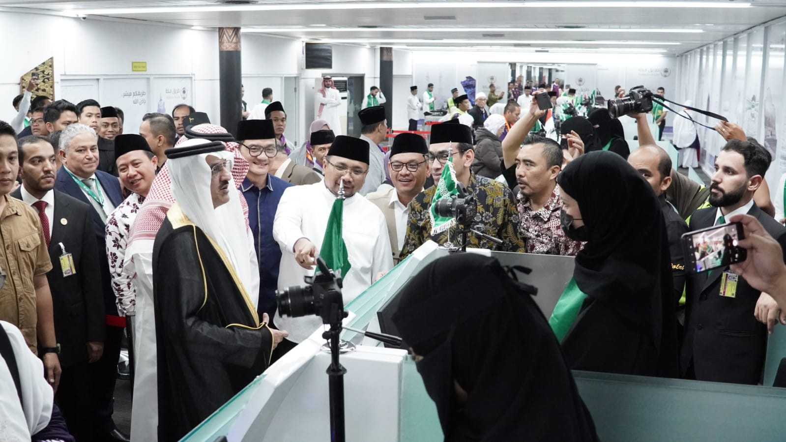 Religious Affairs Minister Yaqut Cholil Qoumas, Saudi Ambassador to Indonesia Faisal Abdullah Amodi, and other officials oversee the Makkah Route initiative at the Soekarno-Hatta International Airport in Jakarta in this photo posted on May 12, 2024. (Supplied)