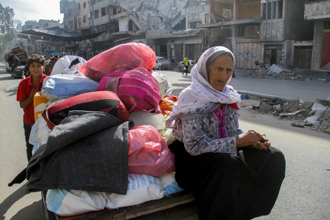 Displaced Palestinians, who fled Jabalia after the Israeli military called on residents to evacuate, travel in an animal-drawn cart in Gaza City, May 12, 2024. (Reuters)