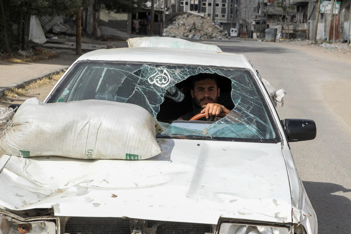 A displaced Palestinian man drives a car damaged during Israel's military offensive as he flees Rafah, in the southern Gaza Strip May 12, 2024. (Reuters)