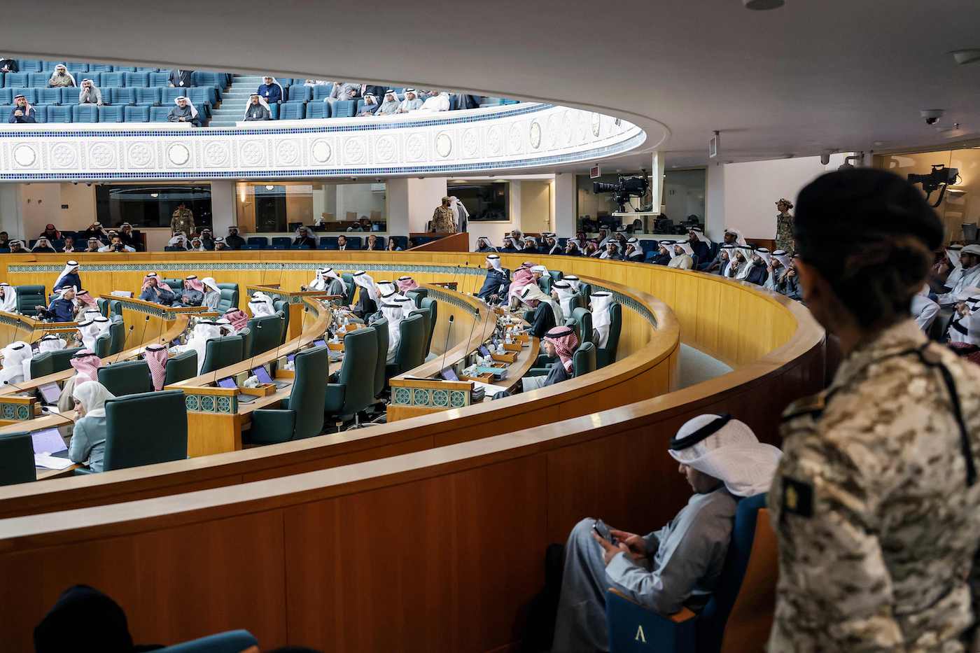Female security guard stands by as Kuwaiti lawmakers attend a parliament session at the National Assembly in Kuwait City. (File/AFP)