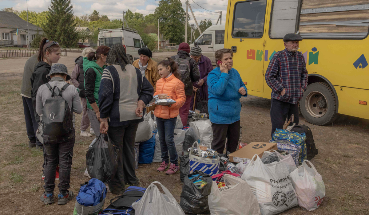 Evacuees from the town of Vovchansk arrive at an evacuation point in Kharkiv region, on Sunday as Russian forces renew a ground offensive. (AFP)