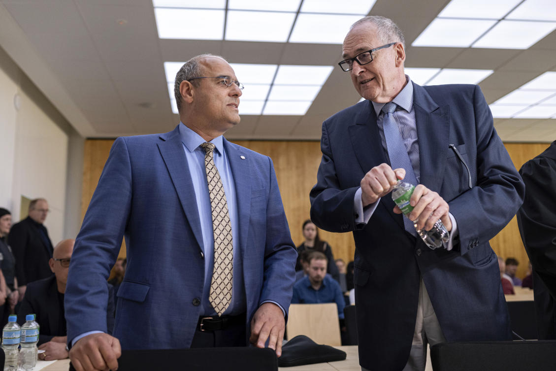 Deputy federal spokesperson for Alternative for Germany party (AfD) Peter Boehringer, left, and assessor on the AfD’s federal executive board Roman Reusch stand in the courtroom before the verdict in the appeal proceedings in the dispute over the classification of the AfD by the Federal Office for the Protection of the Constitution at the Higher Administrative Court for the state of North Rhine-Westphalia, in Muenster, Germany, Monday May 13, 2024.(AP)