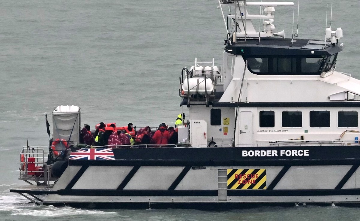 UK Border Force vessel 'Defender', carrying migrants picked up at sea attempting to cross the English Channel from France, returns to the Marina in Dover southeast England, on January 17, 2024 (AFP)