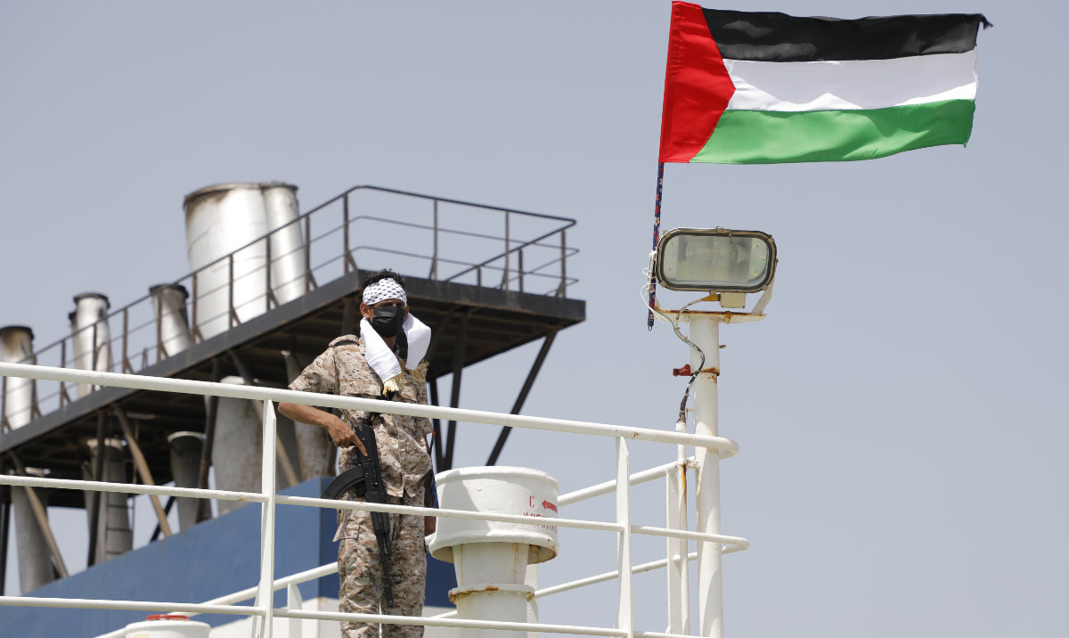 A Houthi soldier stands on board of the Israeli Galaxy ship which was seized by the Houthis, in the port of Saleef, near Hodeidah, Yemen, Sunday, May 12, 2024. (AP)