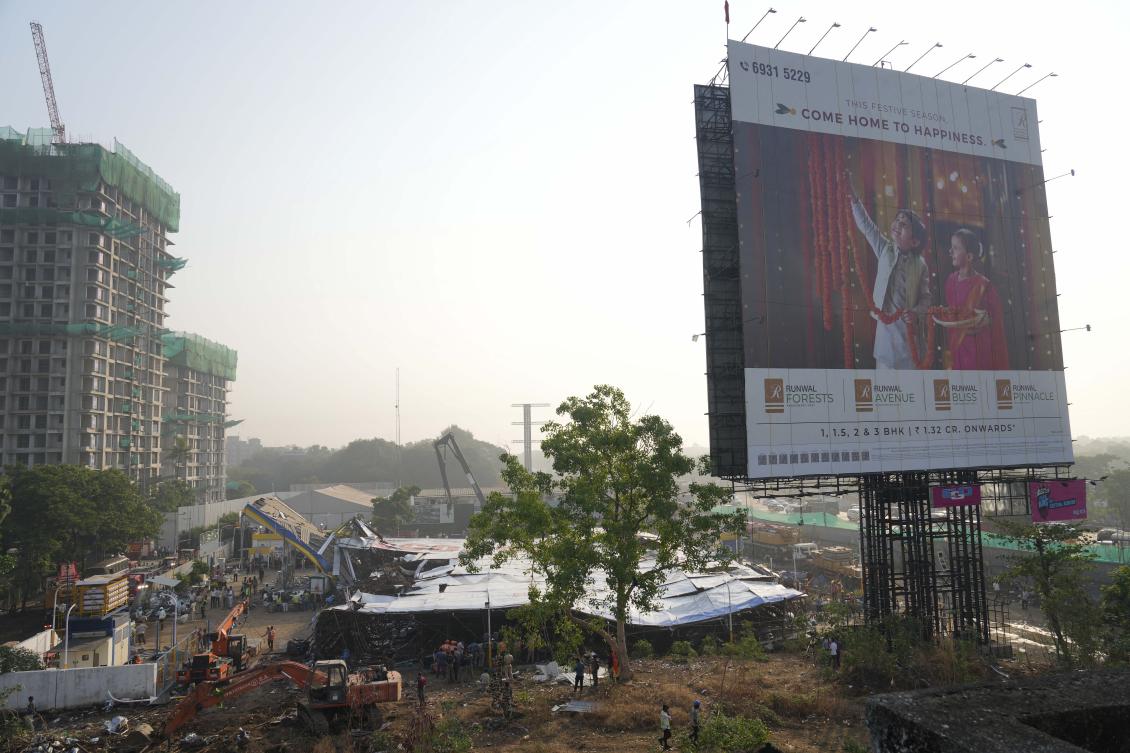 The unauthorized billboard that collapsed was nine times more than the maximum permitted size for a hoarding, municipal authorities said. (AP)