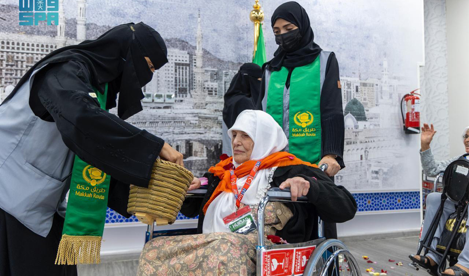 Officials of Makkah Route Initiative receive a pilgrim ahead of annnual Hajj pilgrimage in Saudi Arabia on May 14, 2024. (SPA)