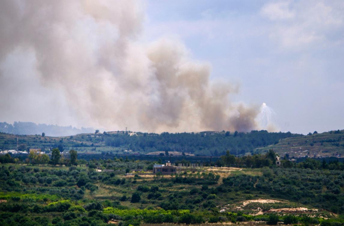 Smoke billows over the Lebanese village of Alma Al-Shaab on May 14, 2024, in southern Lebanon near the border with Israel. (AFP)