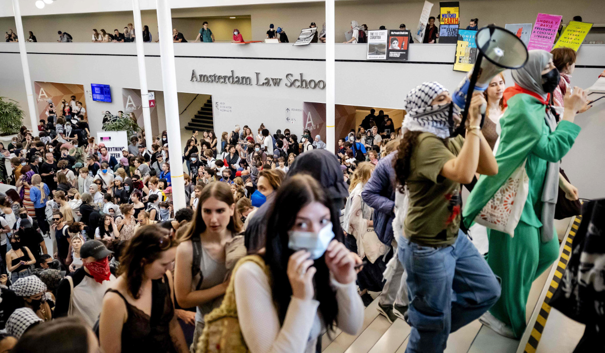 People demonstrate in the ABC building of the University of Amsterdam on the Roeterseiland campus in central Amsterdam on May 13, 2024 in the wake of similar protests of students at universities in several European countries that have followed the actions on US campuses where demonstrators have occupied halls and facilities to demand an end to partnerships with Israeli institutions because of Israel's punishing assault on Gaza. (AFP)