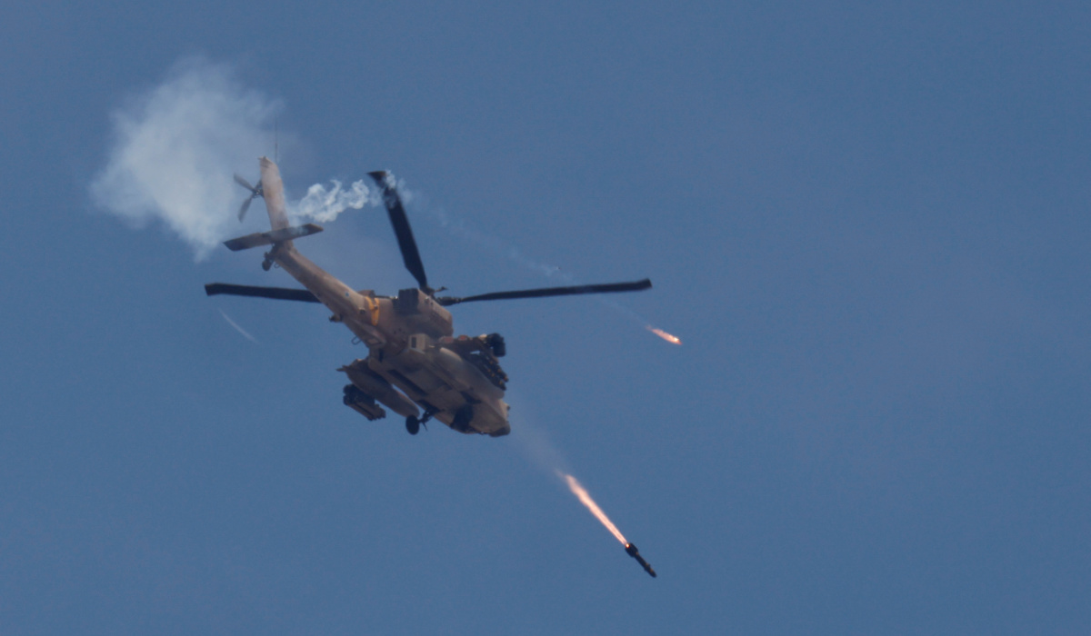 An Israeli military Apache helicopter fires missiles towards Gaza, amid the ongoing conflict between Israel and the Palestinian Islamist group Hamas, as seen from southern Israel, May 14, 2024. (REUTERS)