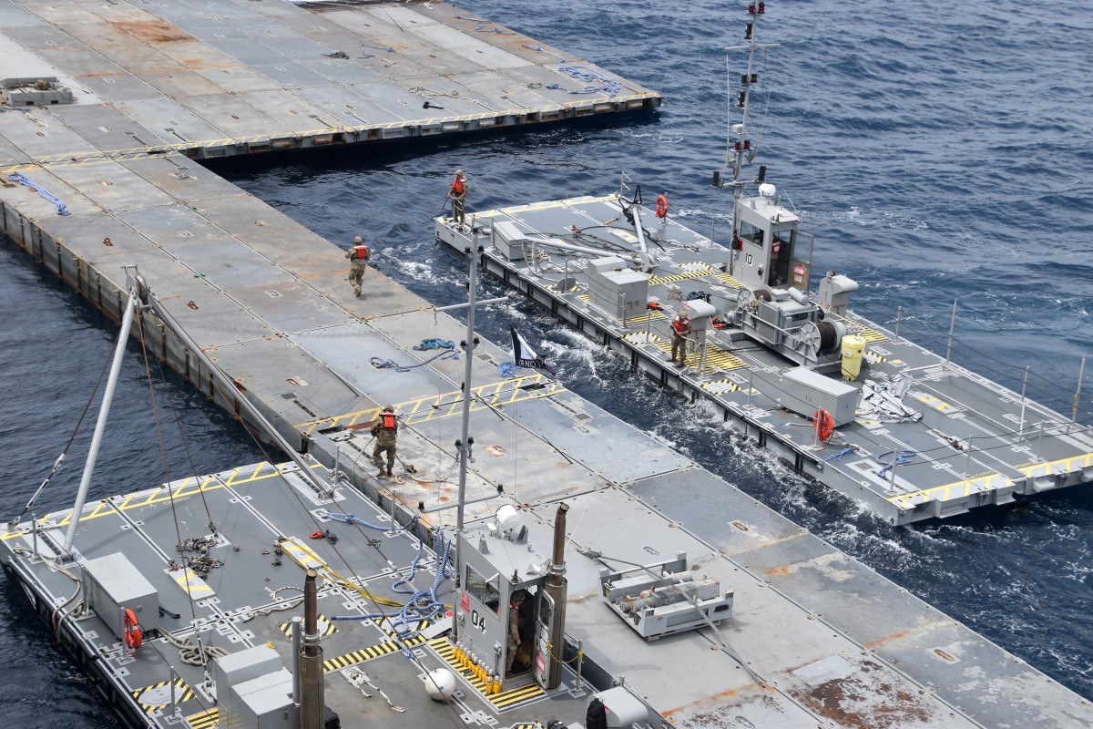 This handout picture courtesy of the US Central Command (CENTCOM) taken on April 26, 2024 shows construction work on the floating JLOTS pier in the Mediterranean Sea, which will support the US Agency for International Development (USAID) and partners to receive and deliver humanitarian aid to the Gaza Strip. (AFP)