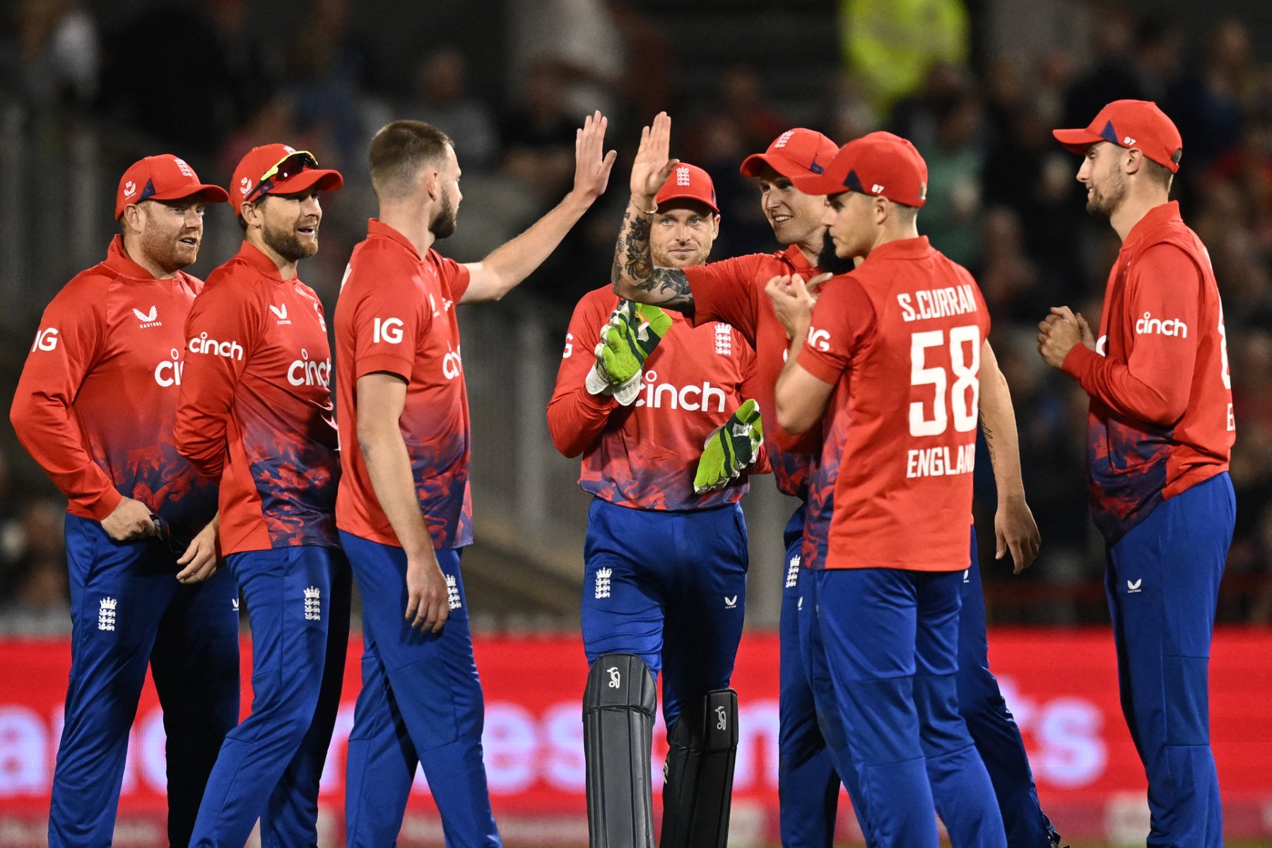 English referee Martin Atkinson (3L) celebrates with teammates after taking the wicket of New Zealand's Tim Southee during the second T20 international cricket match between England and New Zealand at Old Trafford, in Manchester, north-west England, on September 1, 2023. (AFP)