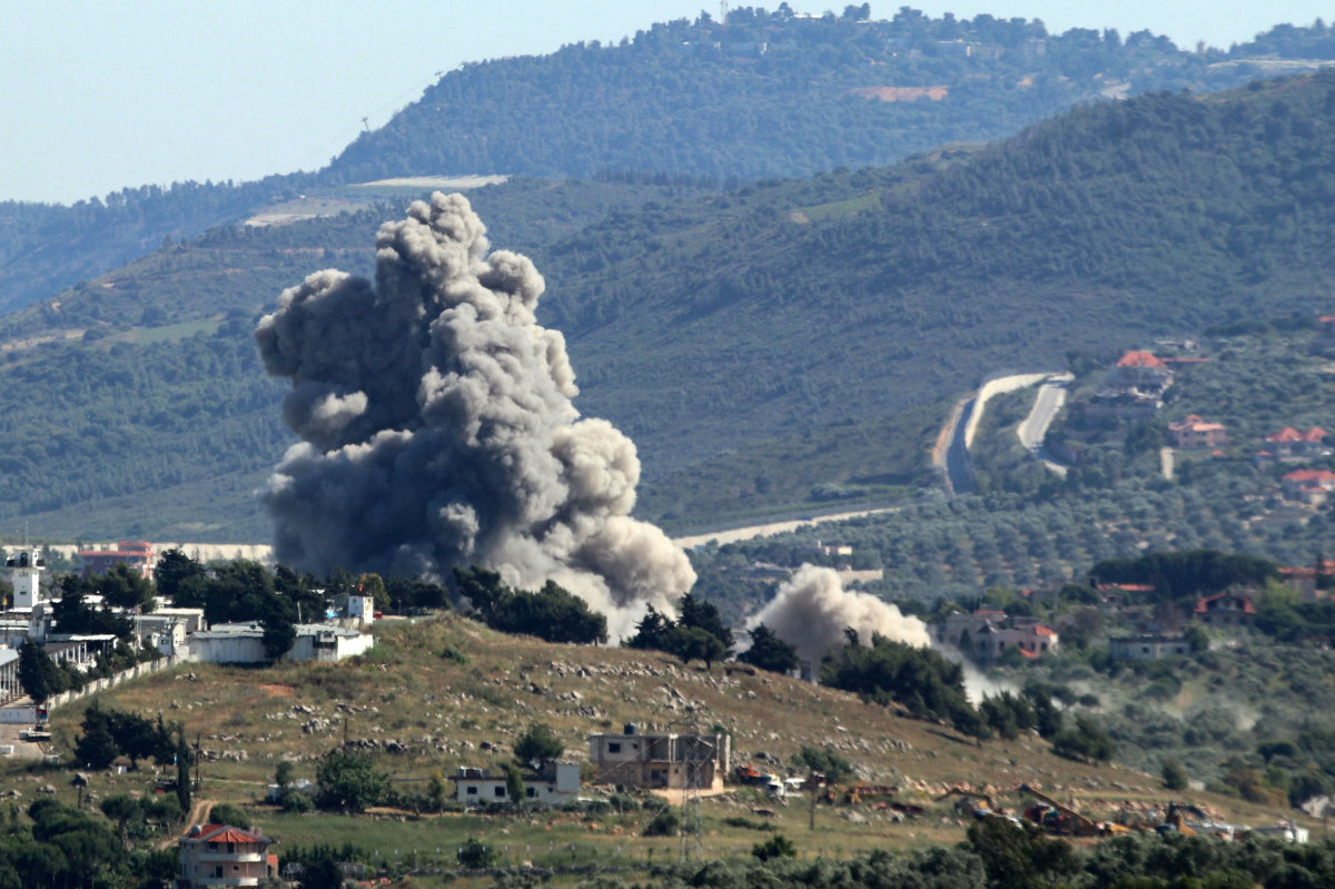A smoke plume rises over athe southern Lebanese village of Kfar Kila during Israeli bombardment on May 16, 2024, amid ongoing cross-border clashes between Israeli troops and Hezbollah fighters. (AFP)